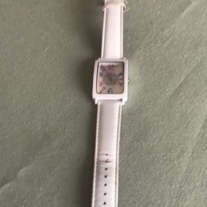 White leather band watch. Colored numbers inside.